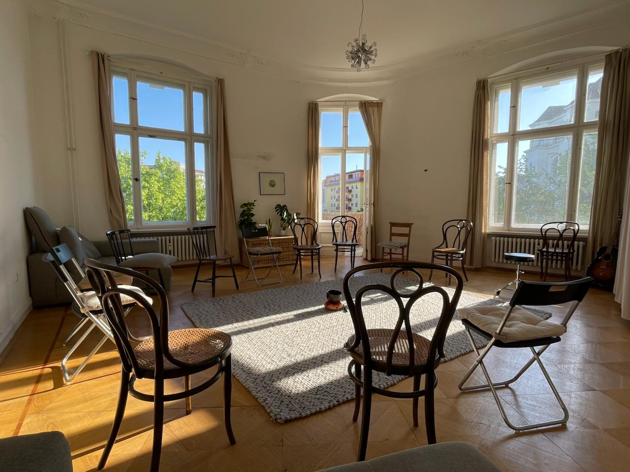 Chairs in a circle in a sunlit room