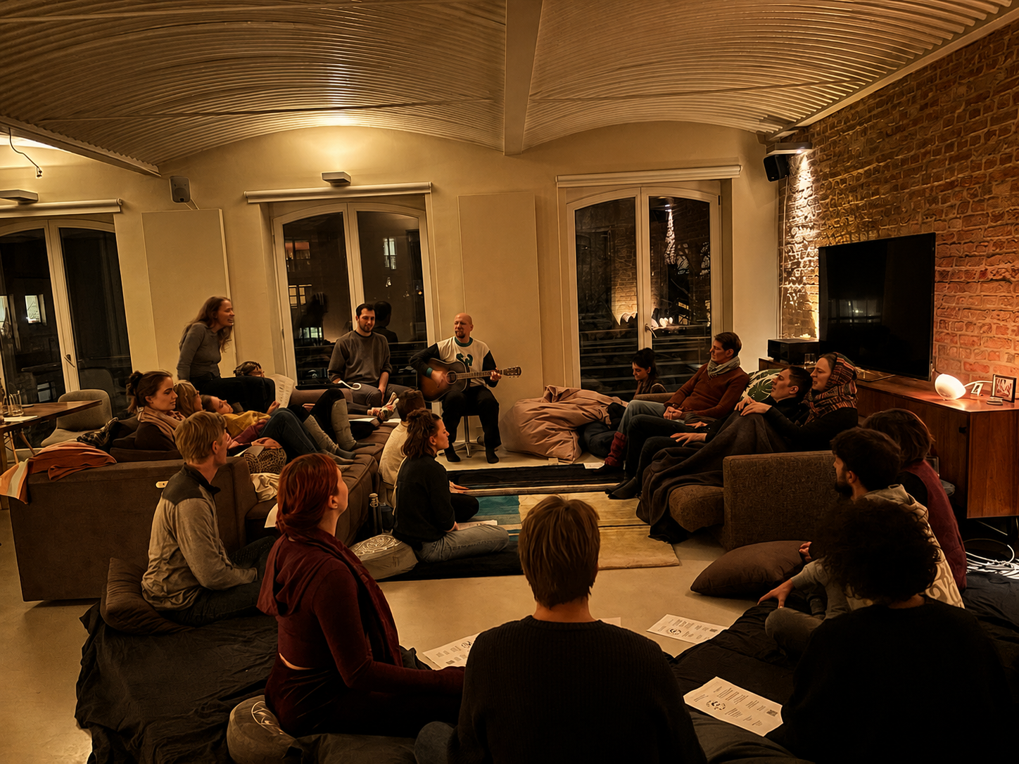 People sitting on the floor of a living room, singing together